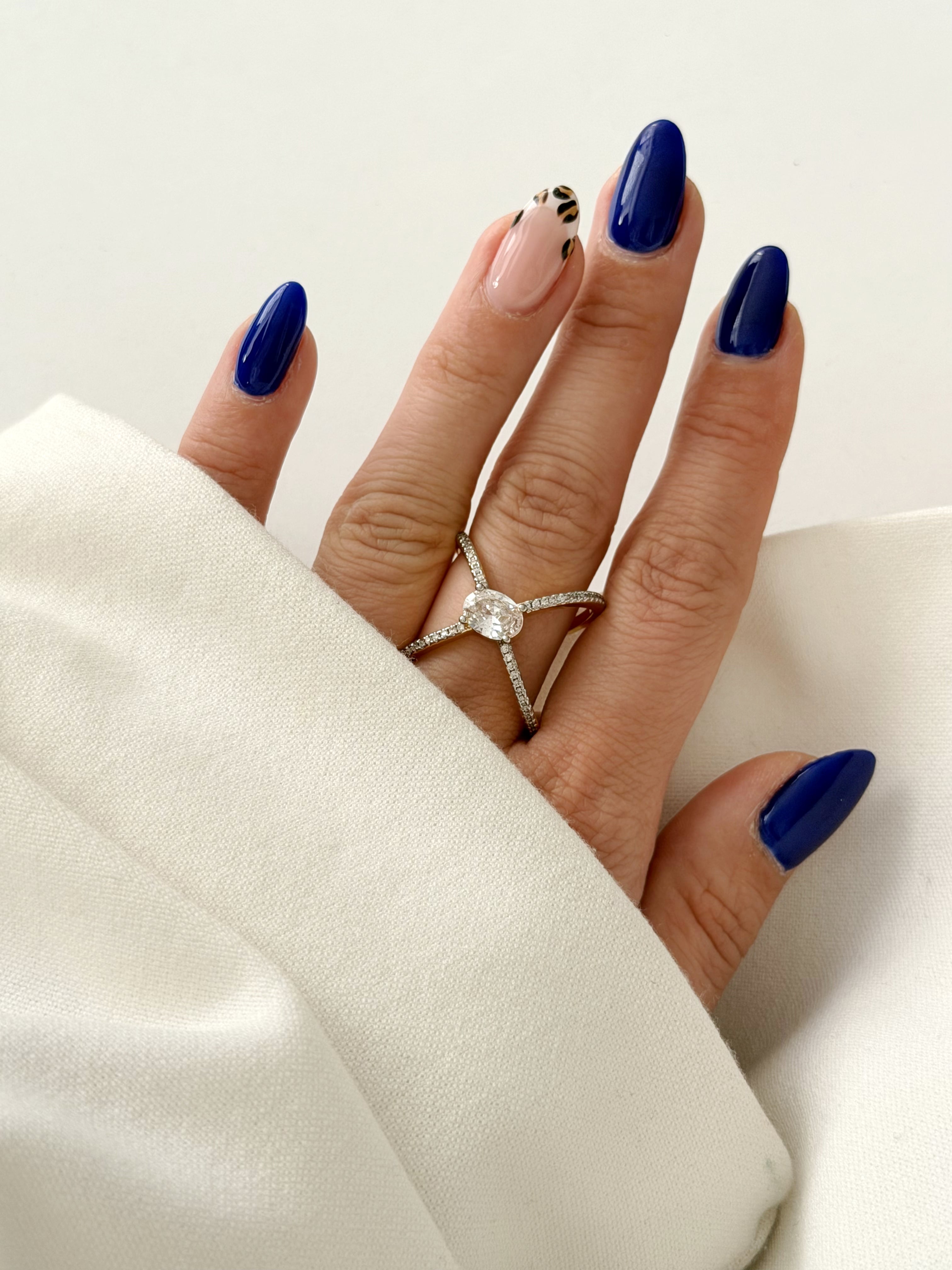 CW1RING00203-silver-cz-pave-criss-cross-x-oval-solitaire-statement-ring-alternate-angle-catwalkjewellery wholesale jewelry RINGS Catwalk Jewellery Europe