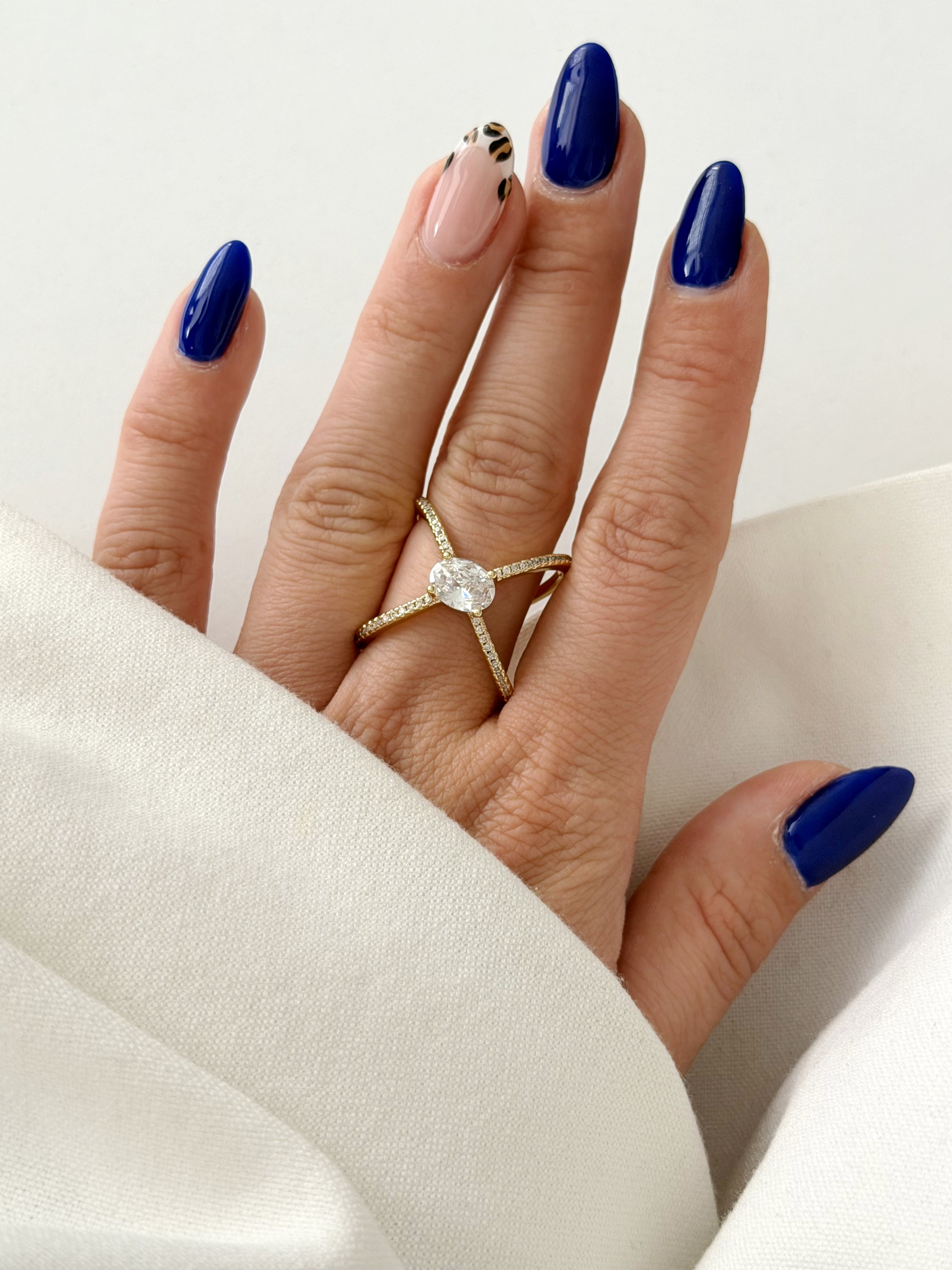 CW1RING00204-gold-cz-pave-criss-cross-x-oval-solitaire-statement-ring-catwalkjewellery wholesale jewelry RINGS Catwalk Jewellery Europe